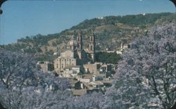 Santa Prisca Church, Taxco, Mexico with Jacaranda Trees Postcard