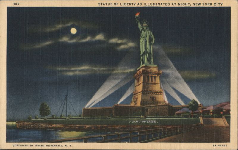 STATUE OF LIBERTY AS ILLUMINATED AT NIGHT New York City
