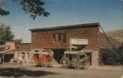 The Livery Stable, Blacksmith & Wagon Shop with Wagons Postcard