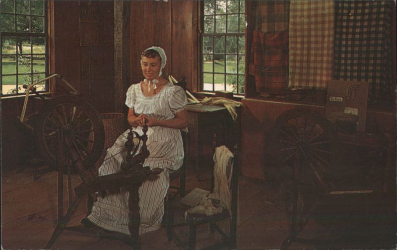 Spinning at the foot wheel, Old Sturbridge Village Massachusetts