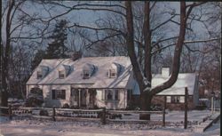Snow-Covered Cape Cod Style House with Dormer Windows Postcard