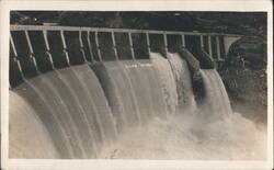 Dam with Multiple Spillways and Rushing Water Postcard