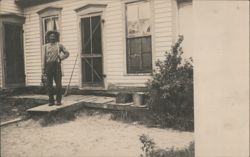 Man in Hat & Suspenders on Porch of White House Postcard