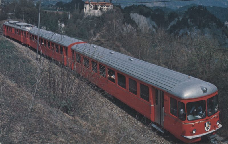 Rhaetian Railroad train with Castle of Rhaezuens Switzerland