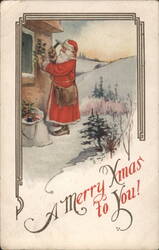 Santa Claus Nailing Holly to Window in Snowy Landscape, "A Merry Xmas to You!" Postcard