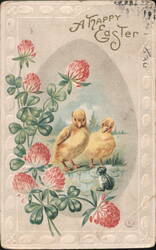 A Happy Easter Greeting with Ducklings, Frog, and Clover Flowers Postcard