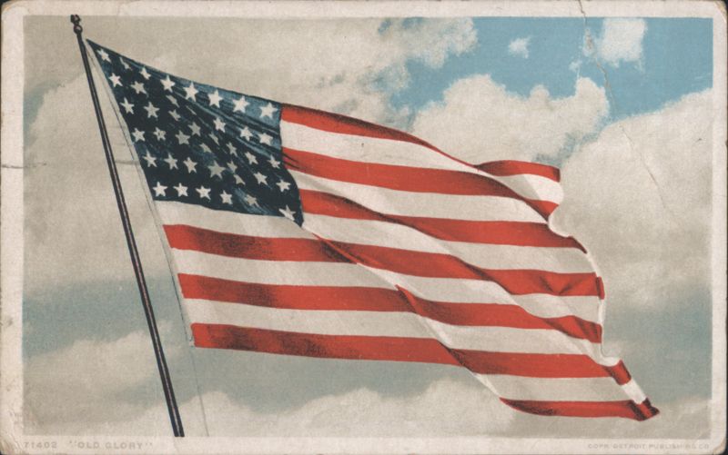 American Flag 'Old Glory' Waving Against a Cloudy Sky