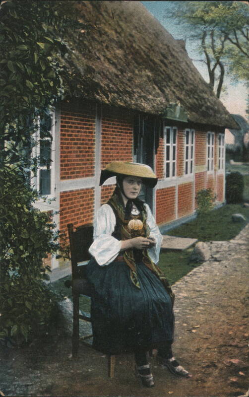 Woman in Vierlande Traditional Costume by Thatched Roof House, Hamburg