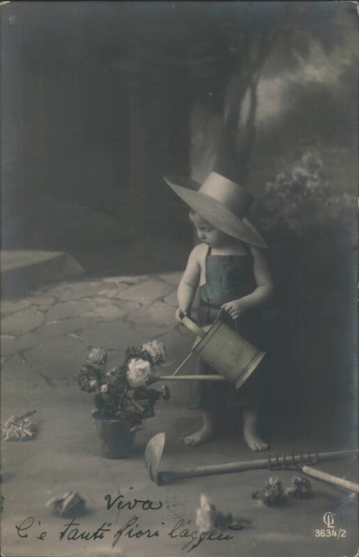 Child in Straw Hat Watering Roses with Gardening Tools