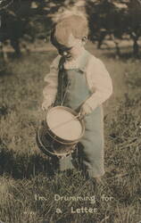 Toddler Playing Drum 'I'm Drumming for a Letter' in Grassy Field Postcard
