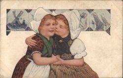Dutch Girls in Traditional Attire Embracing and Kissing, Windmill & Sailboats Postcard
