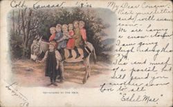 Children and Donkey "Loaded to the Neck" in Colby, Kansas Postcard