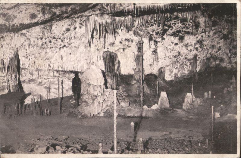 Cave Interior with Stalactites, Stalagmites & Person