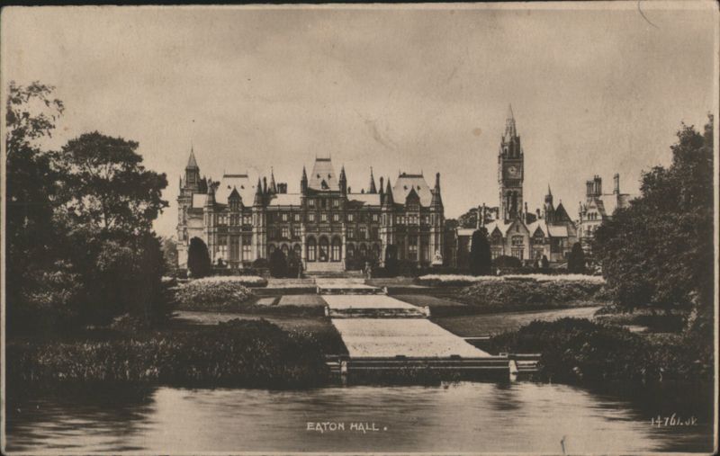 Eaton Hall stately home, clock tower, by water United Kingdom