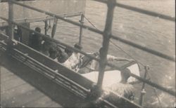 Sailors Handling Stretcher on Ship Deck Postcard