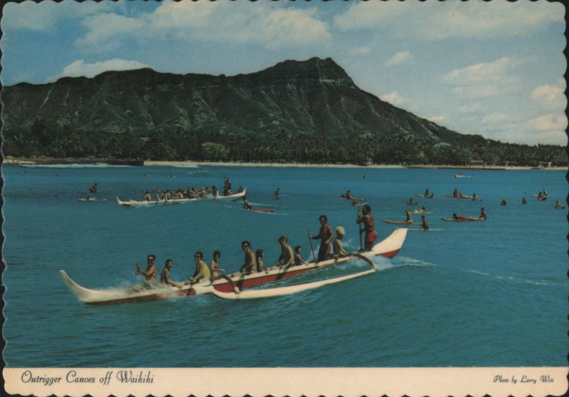 Colorful Outrigger Canoes Riding Waves off Waikiki Beach Honolulu Hawaii