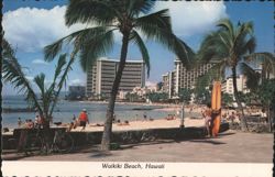 Waikiki Beach Scene with Palm Trees, Surfers, and Hotels Postcard