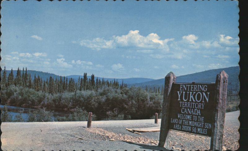Yukon Border Sign, Alaska Highway, Land of Midnight Sun YT Canada