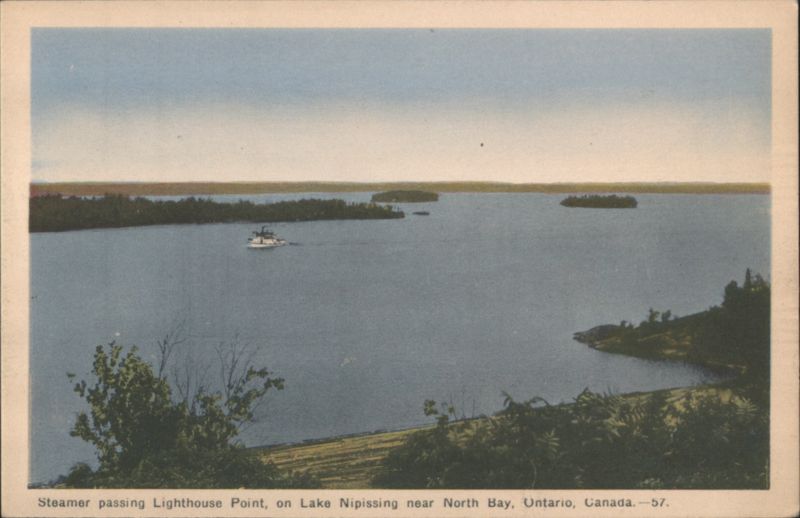 Steamer passing Lighthouse Point, Lake Nipissing North Bay ON Canada