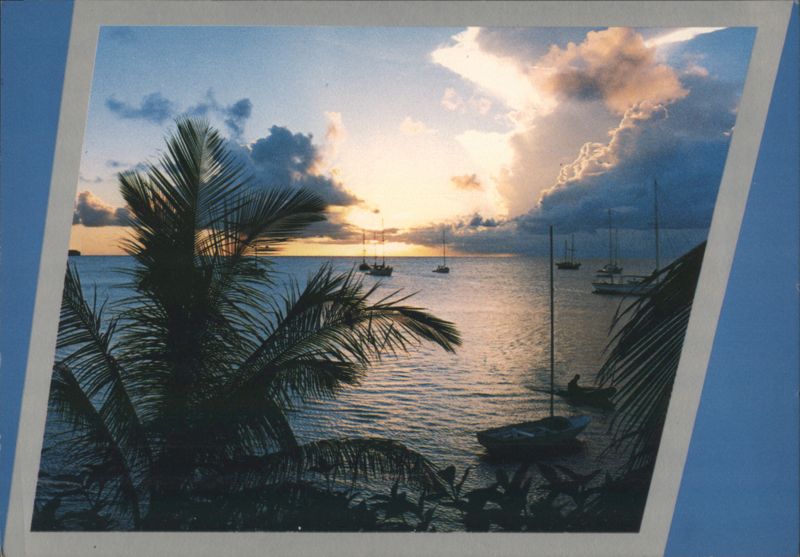 Tropical Sunset with Sailboats and Palm Trees