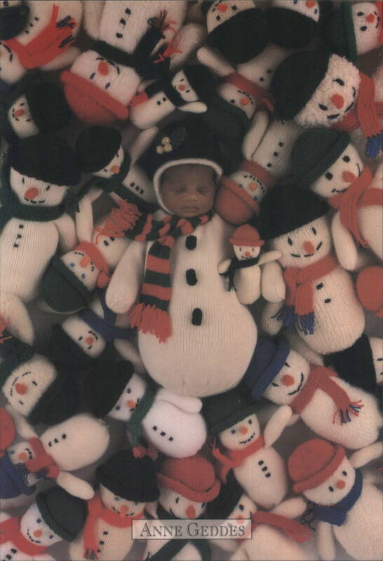 Baby Snowman Surrounded by Snowman Dolls by Anne Geddes