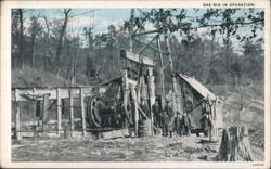 Gas Rig in Operation with Workers in Wooded Area Postcard