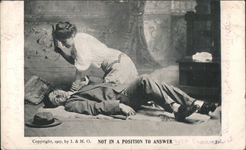 Woman with rolling pin over man on floor, 'Not in a Position to Answer