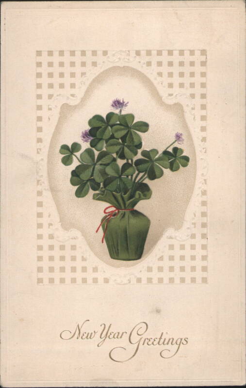 New Year Greetings with Four-Leaf Clover Plant