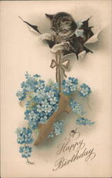 Kitten bursting through paper with blue flowers and shoe, Happy Birthday Postcard