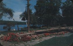 Tamiment Landscaped Pond with Floral Gardens & Bridge Postcard