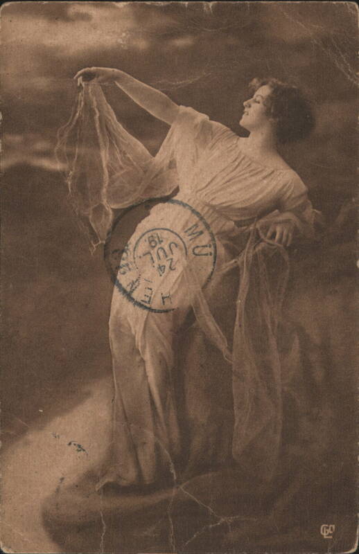 Woman in Flowing Dress with Sheer Fabric Women