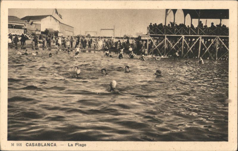 Casablanca Beach Scene with Swimmers and Pier Morocco