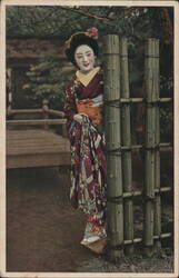 Japanese Woman in Kimono by Bamboo Fence in Garden Postcard