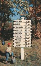 Boy at Sign Post to Norway, Paris, China, Lynchville, ME Postcard