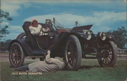 1912 Buick Roadster - Woman Driver, Man Under Car Postcard