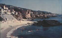 Laguna Beach Shoreline with Swimmers & Cliffside Homes Postcard