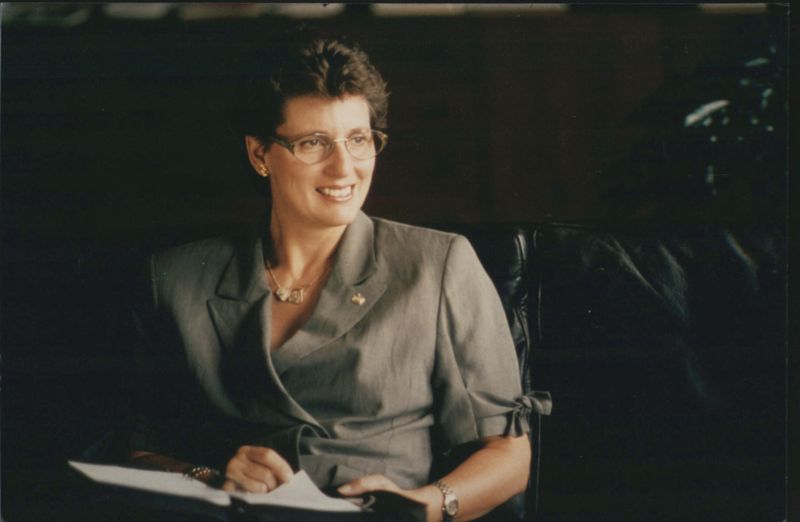 Smiling Woman in Glasses and Suit Women