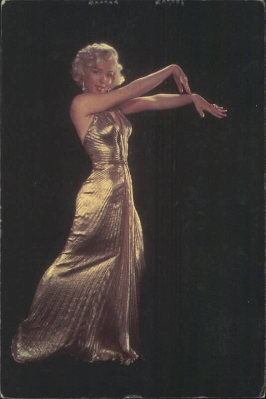 Marilyn Monroe Posing in a Gold Dress Actresses