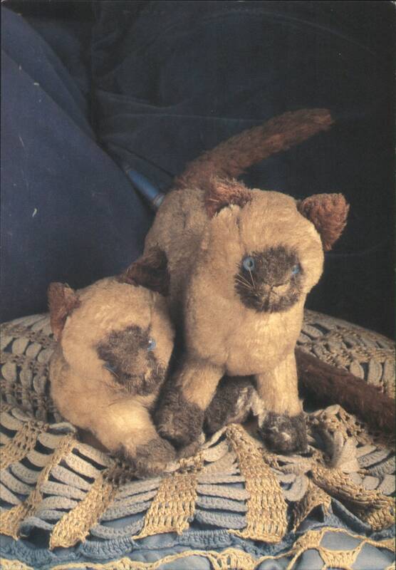 Two Siamese Cat Plush Toys on Crocheted Blanket Miria De Vries