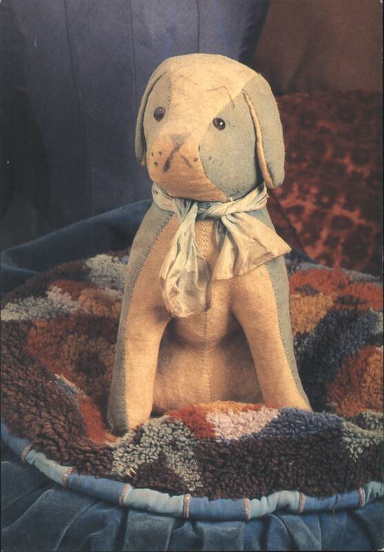 Stuffed Dog Toy in Multi-Colored Bed from The Teddies Series