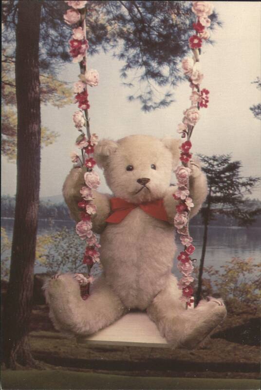 Timothy Teddy Bear on a Floral Swing with Red Bow Tie