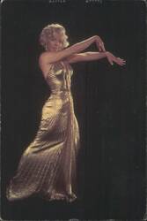 Marilyn Monroe Posing in a Gold Dress Postcard