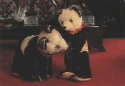 Two Stuffed Panda Bears, One Standing with Red Bow Postcard