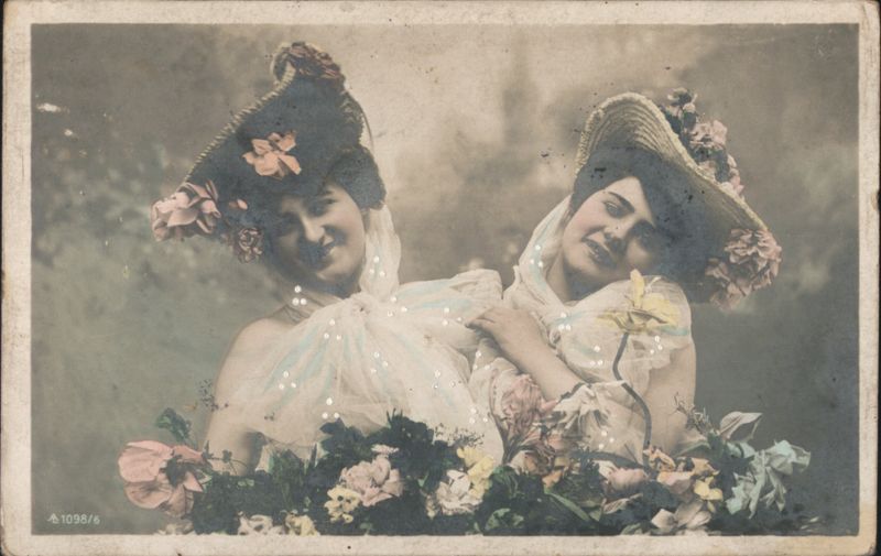 Two Women in Elaborate Floral Hats and Lace Collars