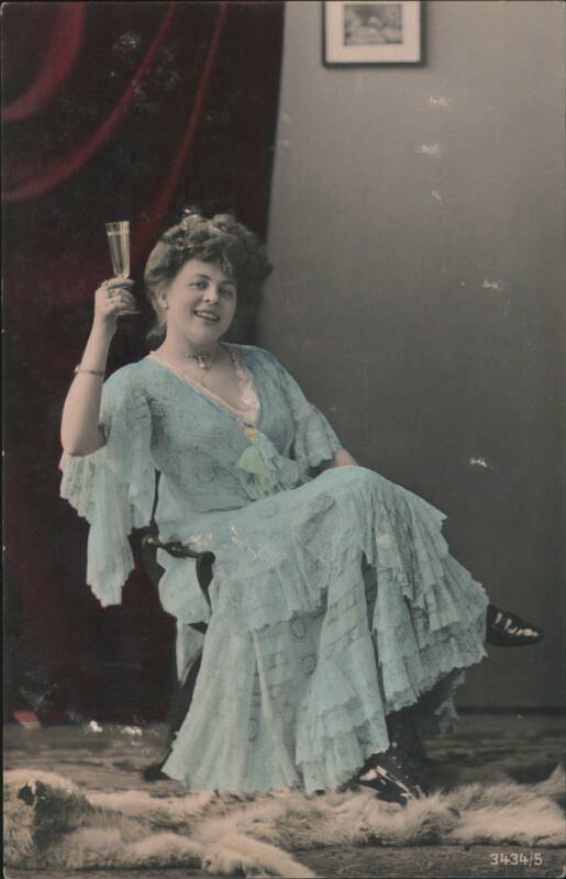 Woman in Blue Lace Dress Toasting with Champagne Beautiful Ladies