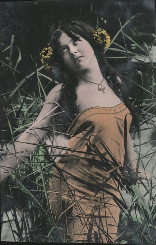 Woman with Yellow Flowers in Hair in Tall Grass Women