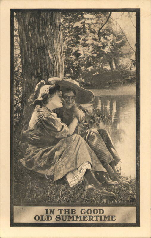 In the Good Old Summertime Couple Resting by Water