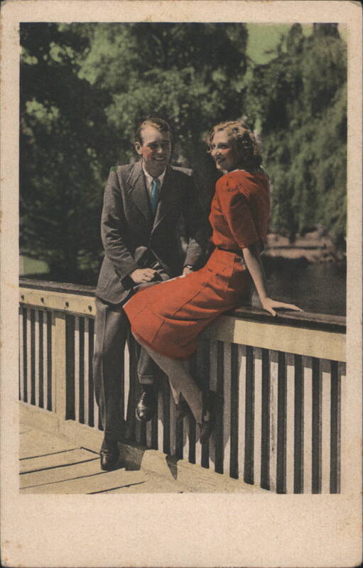 Couple Smiling on a Park Railing Couples