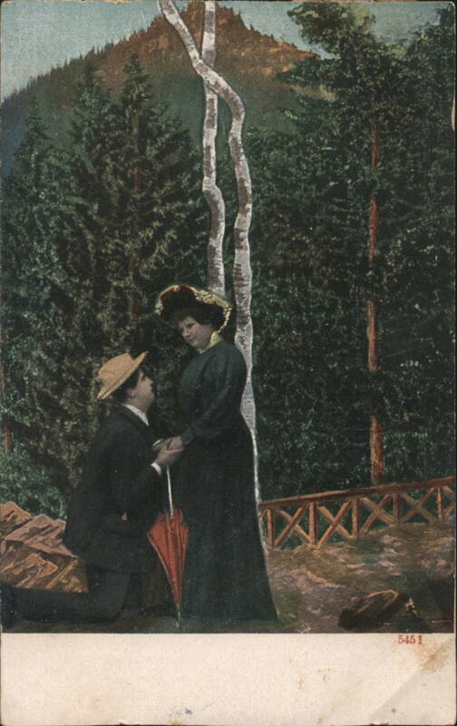 Man Kneeling in Proposal to Woman with Red Umbrella