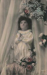 Child in Prayer with Flowers and Lace Curtains Postcard